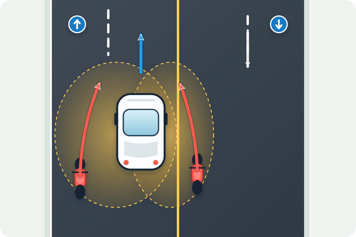 Scooters passing through a rental car’s blind spots on a Phuket road